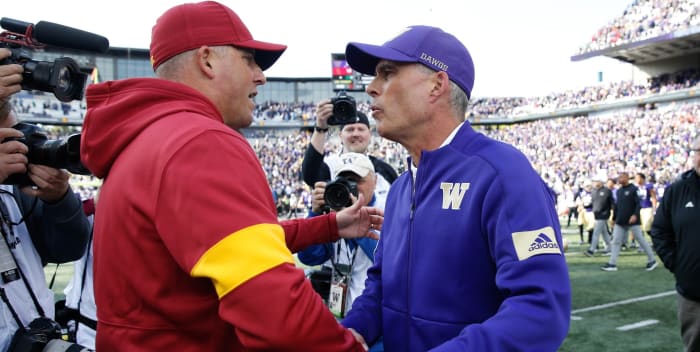 Clay Helton and Chris Petersen, both out of the Pac-12 now, greet each other after the 2019 game, which the UW won 28-14.